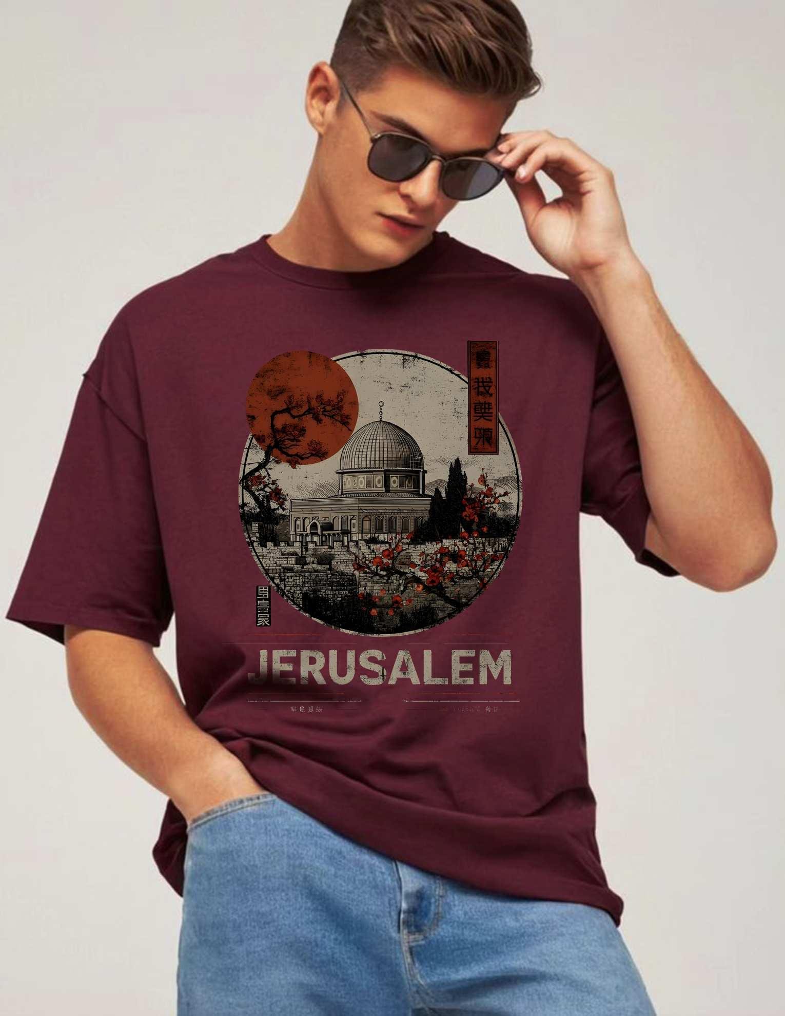 Jerusalem T-Shirt Palestine(2) Start your journey of resistance and pride with the powerful Jerusalem T Shirt Palestine – a bold fashion statement rooted in faith, identity, and heritage. This t-shirt is not just apparel – it’s a message of strength, solidarity, and spiritual connection. The powerful artwork of Masjid Al-Aqsa (Dome of the Rock) stands as a centerpiece, making this the ultimate Jerusalem T Shirt Palestine for those who wish to wear their beliefs with confidence. This premium oversized Palestine t shirt is made for comfort and impact. Crafted with high-quality breathable cotton, it is perfect for streetwear, cultural events, or even as a casual everyday fit. The t-shirt blends Islamic values and artistic freedom with modern fashion, appealing to the global youth movement supporting Palestinian freedom. In the center of the design, the Dome of the Rock is printed with raw texture and earthy tones, paired with the text "Jerusalem" in bold, distressed font. It symbolizes resistance, resilience, and remembrance. Whether you’re attending Friday prayers, a protest, or simply walking the city streets, this Jerusalem T Shirt Palestine speaks volumes without saying a word. Muslim youth around the world are embracing cultural identity through fashion. That’s why this Islamic t shirt isn’t just made for wear – it’s made for purpose. The message of a Free Palestine T Shirt in India or anywhere else is now global. Represent your culture, your faith, and your voice through bold apparel that stands up for justice and unity. In every thread and print, this Jerusalem T Shirt Palestine reminds the world: Palestine is not forgotten. From the spiritual heart of Jerusalem to the voices of youth worldwide, wear it like you mean it.